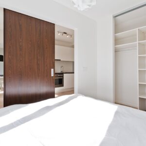 Sliding door roomdivider Strictly + white wardrobe