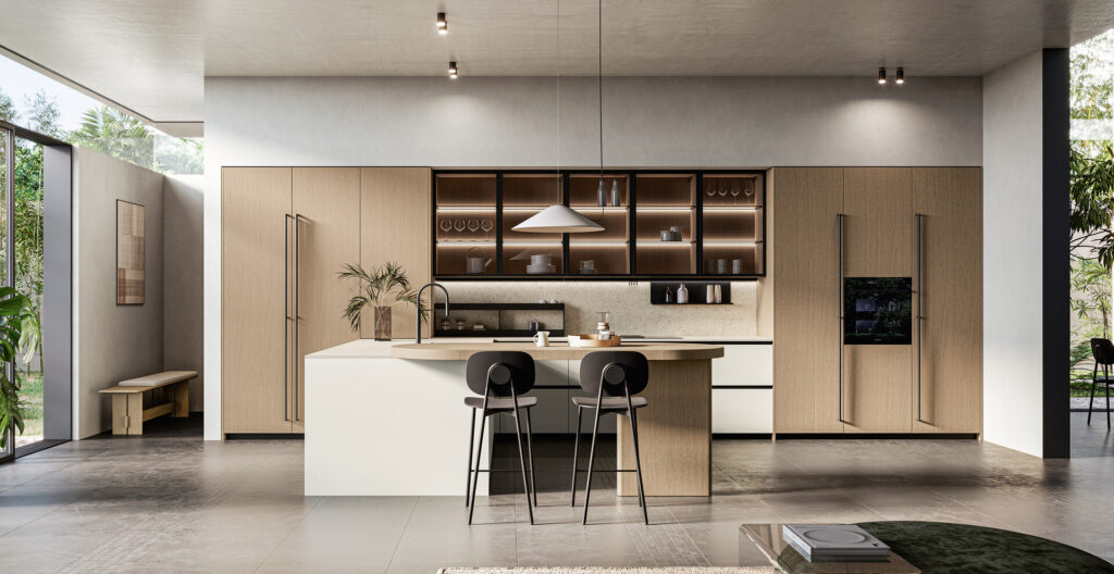 Miljöbild på kök med högskåp i ljus träfanér.